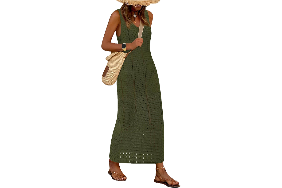 A woman wearing a long, sleeveless, green, crochet style maxi dress.