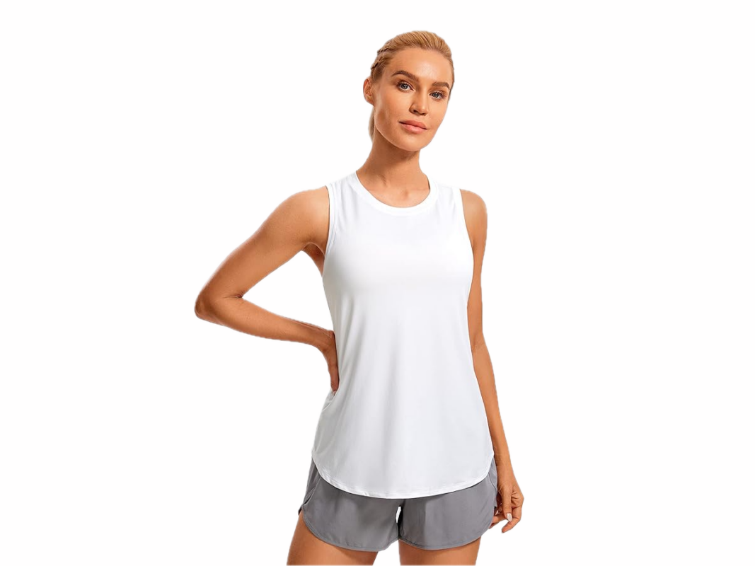 This image features a woman with blond hair wearing a sleeveless white top and grey shorts.