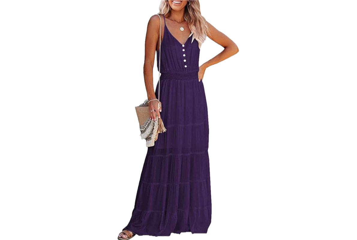 A woman with blond hair wearing a long, sleeveless purple dress.