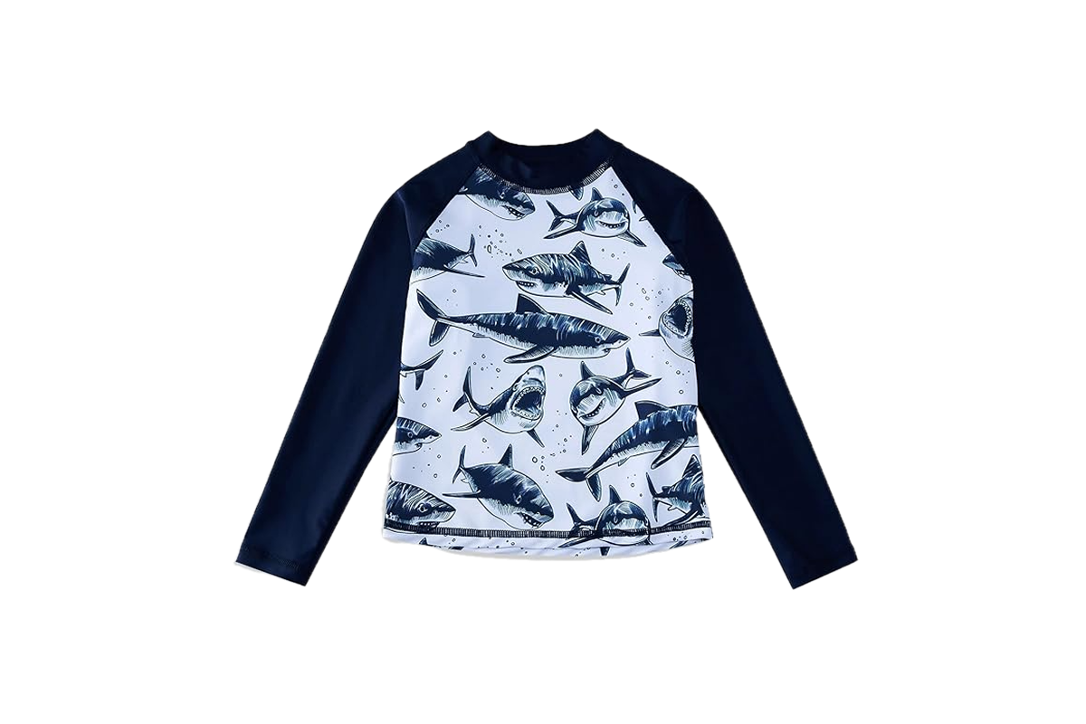 A long sleeve shirt with black and white sharks on the front and dark navy/black sleeves.