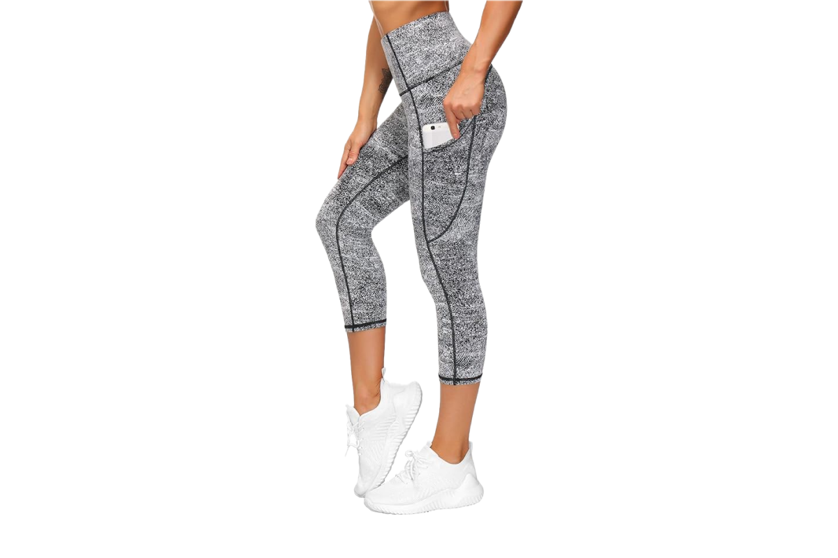 This image features a woman wearing capri length, tight black and white patterned pants.
