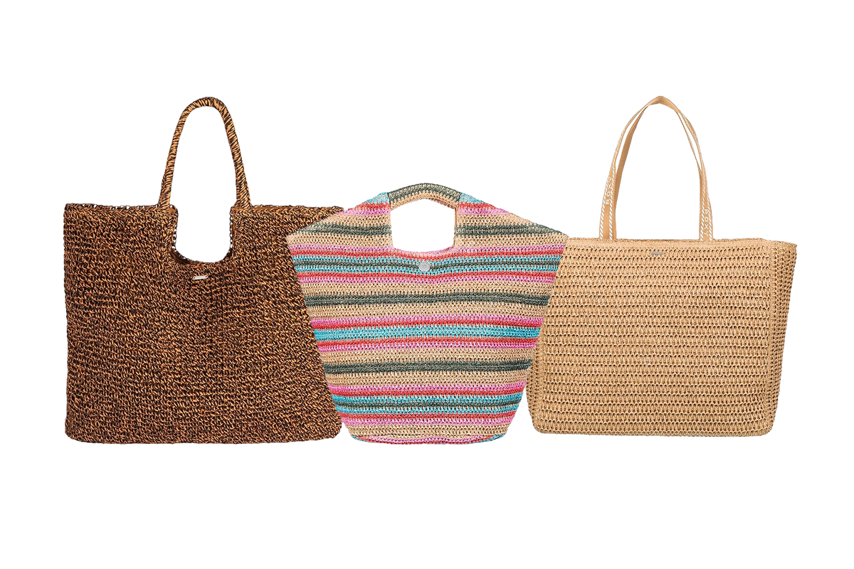 There are three woven straw beach totes: the first is dark brown with a straw handle; the second features pink, red, blue, grey, and tan stripes; and the third is light tan with a straw handle.