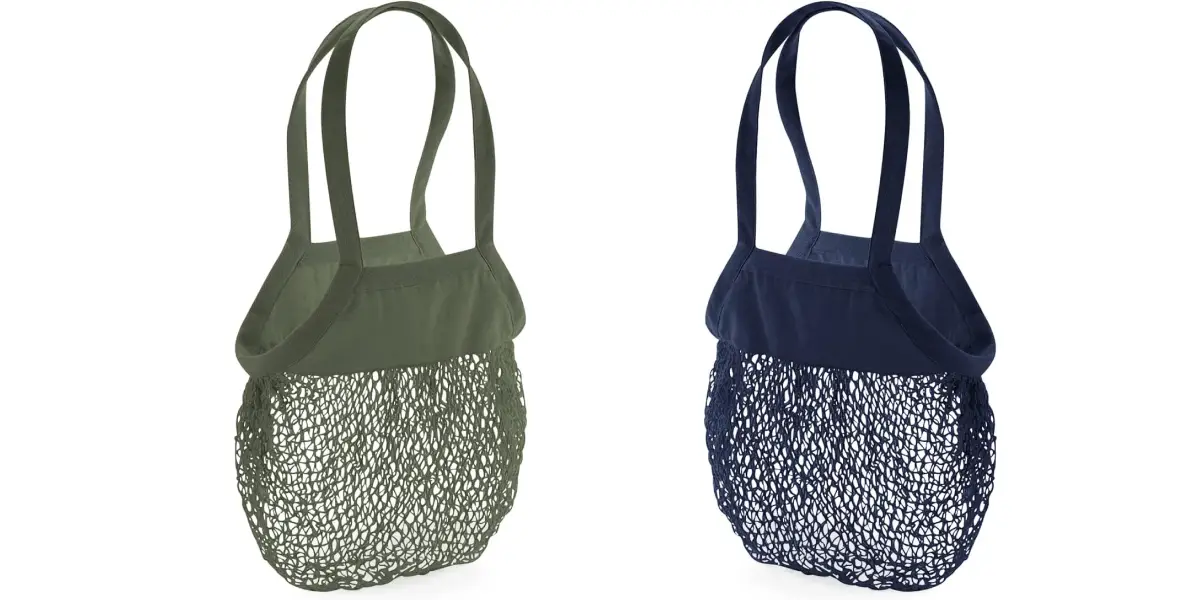 Two reusable mesh shopping bags are pictured. The bag on the left is olive green, and the bag on the right is navy blue. Each sustainably-made beach bag features a solid fabric section at the top with two handles, transitioning to a netted, see-through lower section.