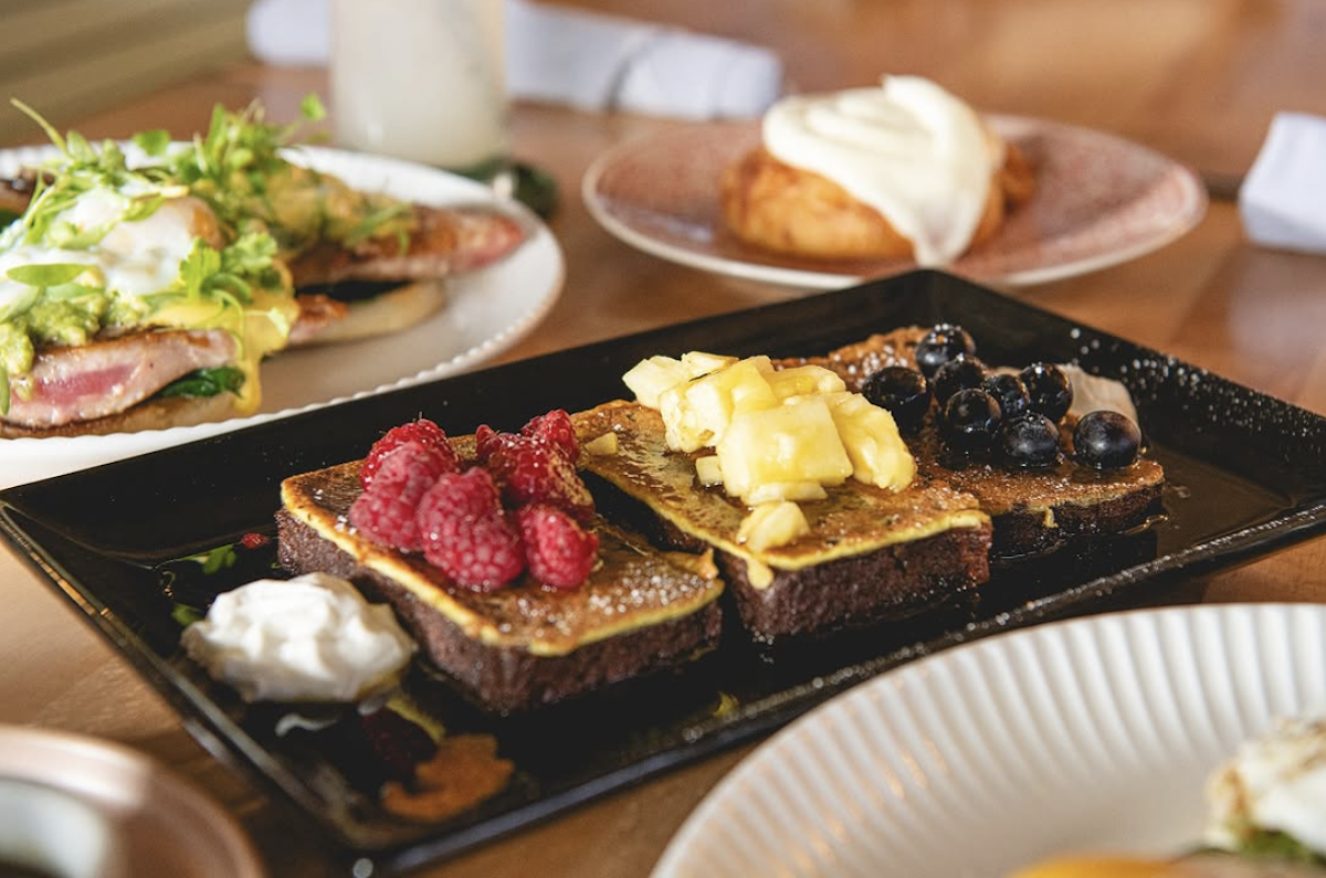 Three pieces of toast each with a different topping, avocado toast and other brunch specials.