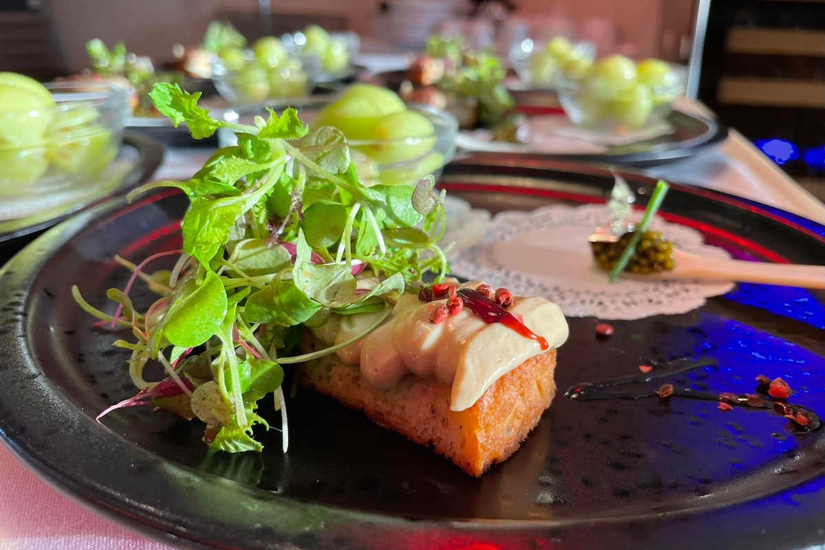 A nicely plated dish garnished with microgreens.