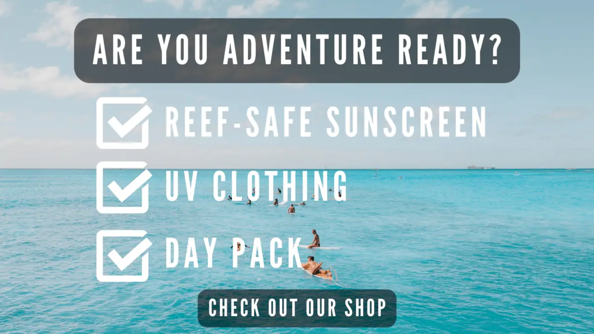 A clear blue ocean scene with several people swimming or paddling in the water. Text overlay reads "ARE YOU ADVENTURE READY?" followed by a checklist: "REEF-SAFE SUNSCREEN," "UV CLOTHING," and "DAY PACK." Discover the best activities for teenagers in Oahu. A button below reads, "CHECK OUT OUR SHOP.