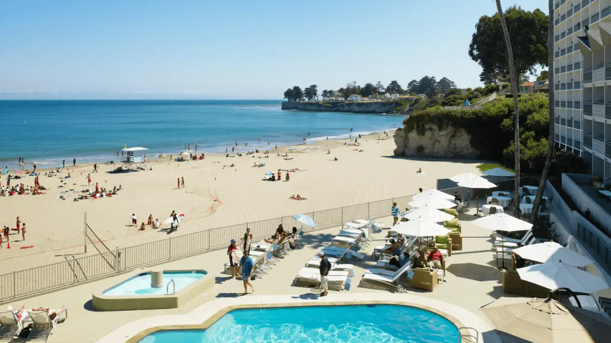 A crowded pool and beach at the Dream Inn in Santa Cruz, California.
