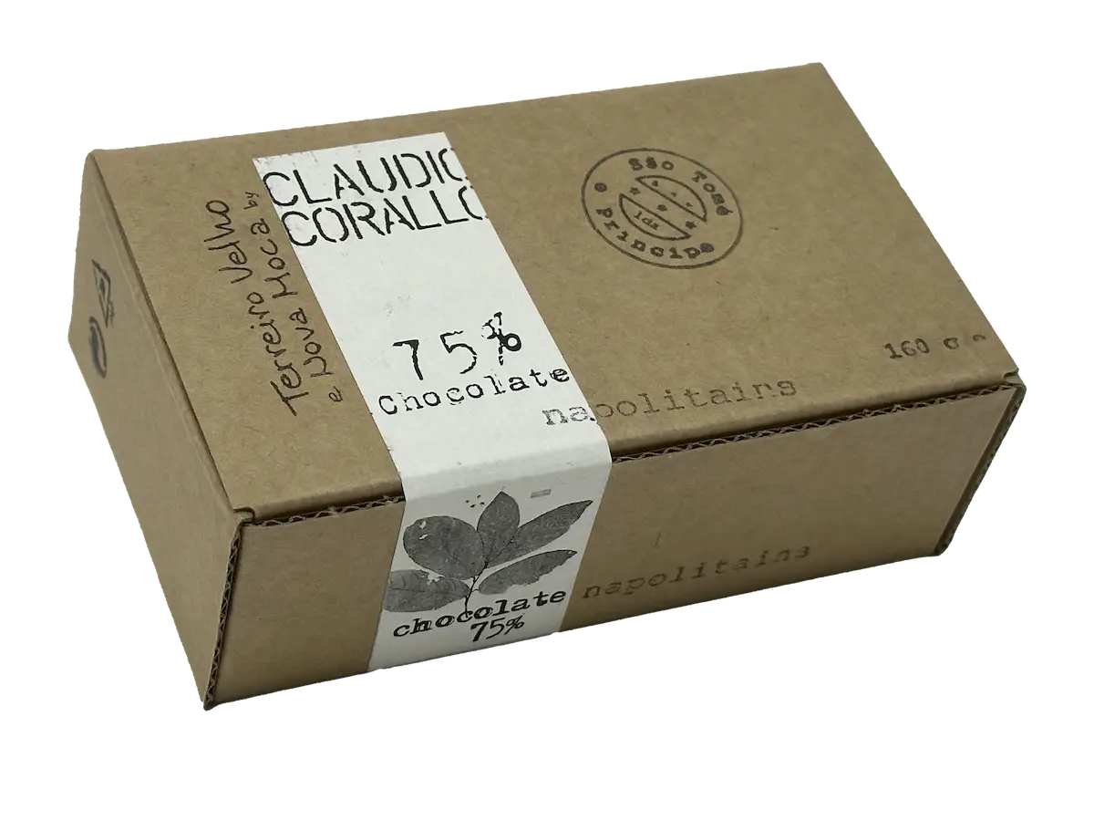 A rectangular cardboard box of Claudio Corallo chocolate. The label states "75% Chocolate" and "neapolitains" with a design featuring a cocoa leaf, highlighting the health benefits of dark chocolate. An additional strip on the box reads "Terreiro Velho Nova Hoca" and indicates a weight of 160g.