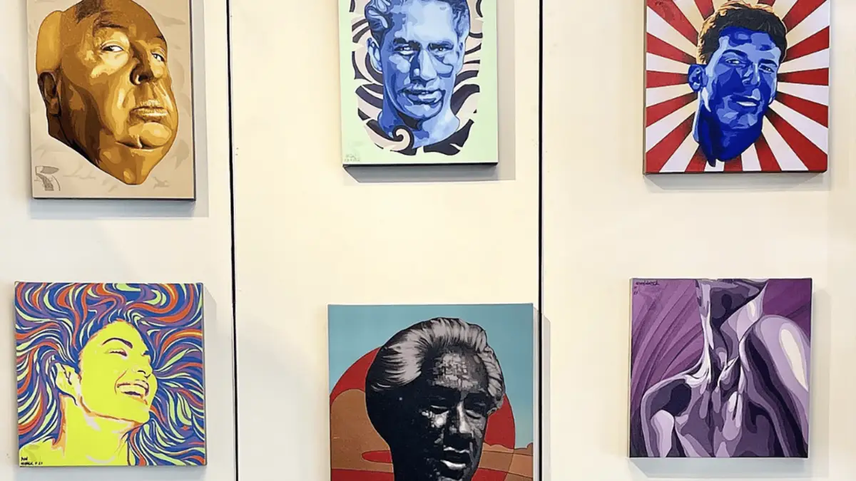 A gallery wall features six colorful, stylized portraits. The top row shows a large face in sepia tones, a blue face with a wavy background reminiscent of "Why Waikiki," and a face with a sunburst pattern. The bottom row displays a smiling face with swirling colors, a shadowed face, and an abstract neck and shoulder.