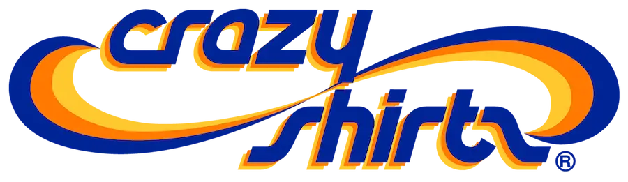 The image displays the "Crazy Shirts" logo, featuring bold, stylized text in dark blue with an orange and yellow curved design running through the letters—perfect for your next visit to Duty Free Shops Hawaii.