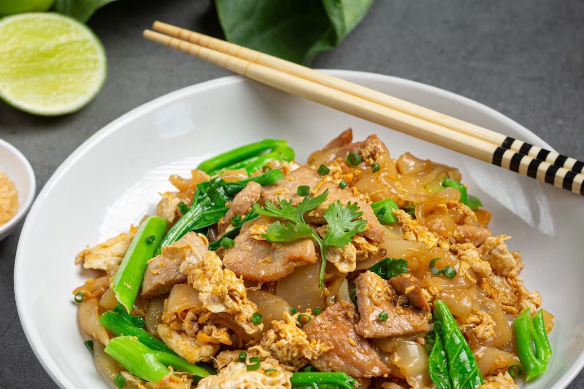 Thai food; Fried noodle with pork in soy sauce and vegetable.