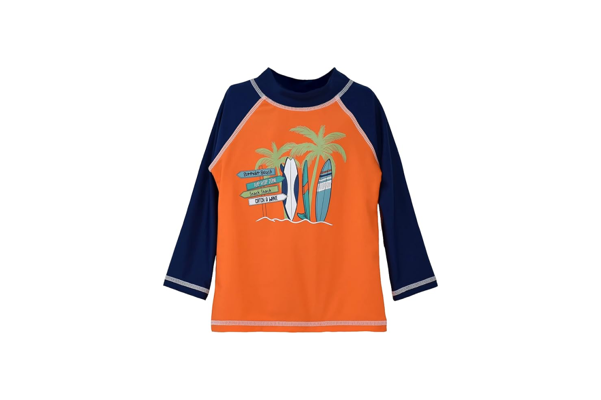 A orange shirt with navy blue sleeves and four colorful surf boards, two palm trees and a wooden direction sign on the front.
