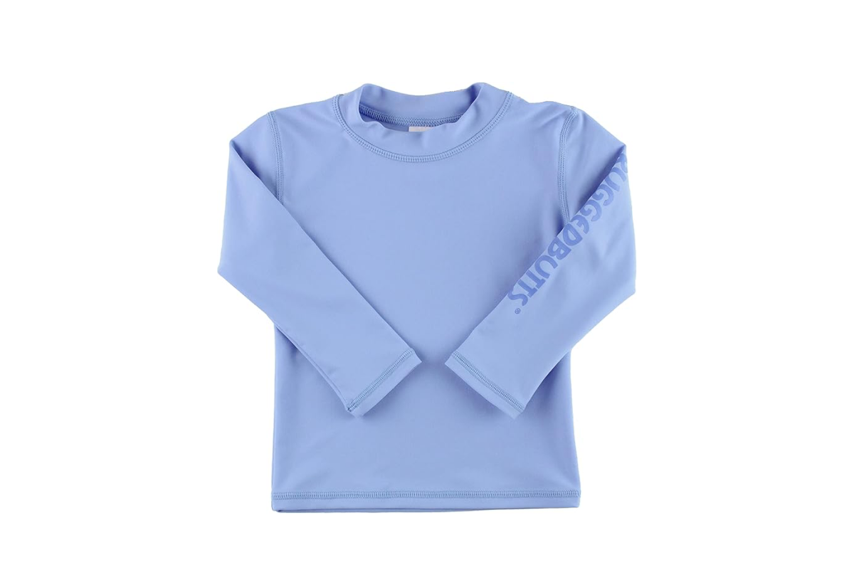 A light purple/blue shirt with long sleeves and the word RUGGEDBUTTS printed down the left sleeve.