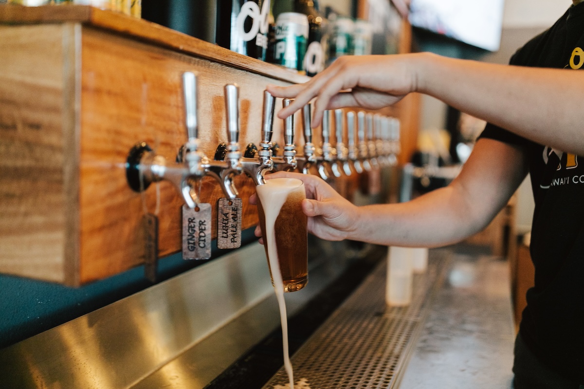 Ola Brew pouring beer from tap