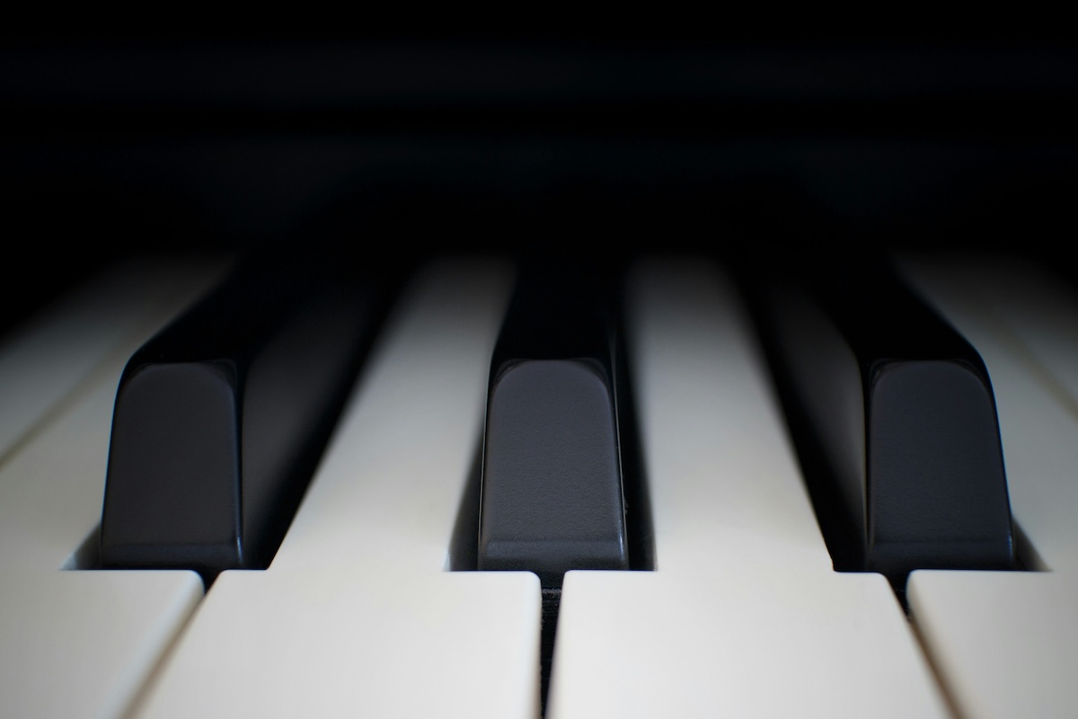 A close up shot of some piano keys.