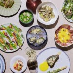 An array of plates with various dishes.