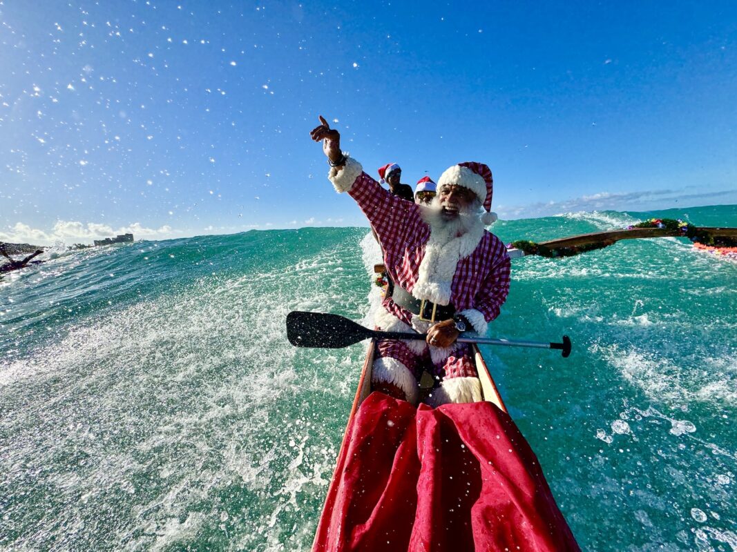 Santa canoeing in Hawaii